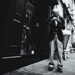 Full length of woman standing in city