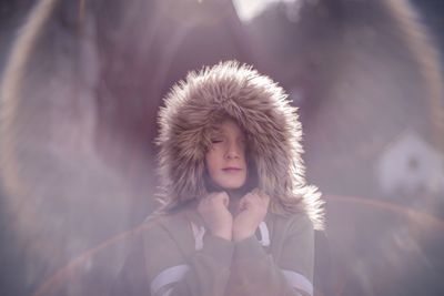 Portrait of a beautiful young woman in winter