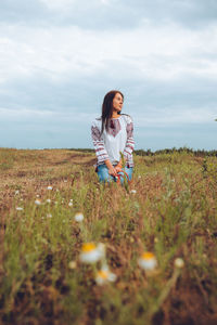 Photo of a smiling young woman in ethnic ukrainian shirt