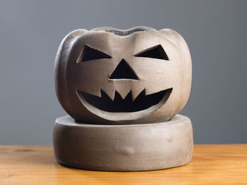 Close-up of pumpkin on table against black background