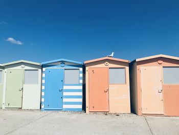 Exterior of colourful buildings against blue sky