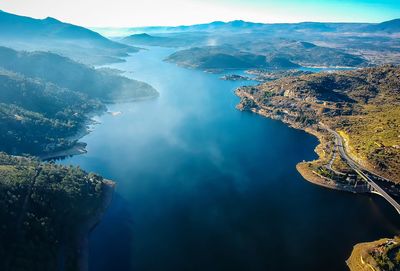 Aerial view of lake amidst mountains