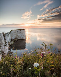 Scenic view of sea against sky during sunset