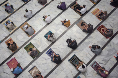 High angle view of people on tiled floor