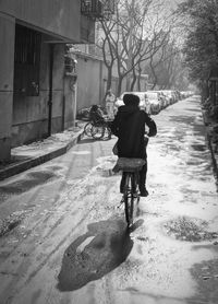 Full length of man walking on road