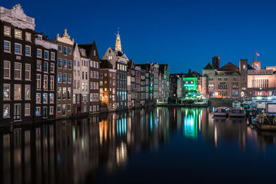 Reflection of illuminated buildings in water