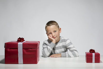 Portrait of boy against white background