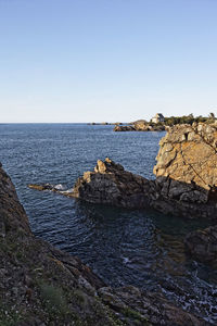 Scenic view of sea against clear blue sky