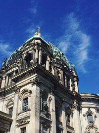 Low angle view of cathedral against cloudy sky