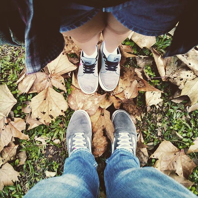 low section, person, shoe, standing, jeans, lifestyles, personal perspective, men, human foot, high angle view, footwear, leisure activity, field, unrecognizable person, leaf, casual clothing, outdoors