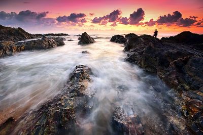 Dramatic sunset over the rocky beach