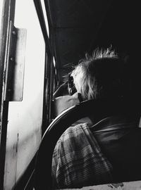 Portrait of man sitting in train