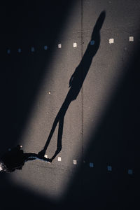 Shadow of man on street