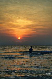 Scenic view of sea at sunset