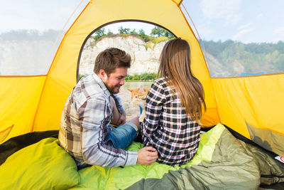 Young couple kissing in tent