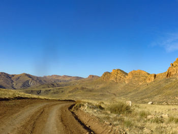 Dirt road passing through a desert