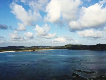 Scenic view of sea against cloudy sky