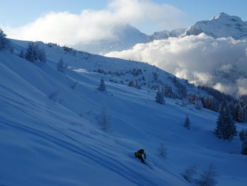 Scenic view of snowcapped mountains against sky