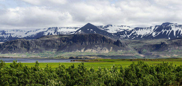 Scenic view of snowcapped mountains against sky