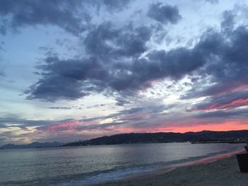 Scenic view of sea against cloudy sky