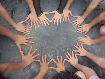 High angle view of people hands