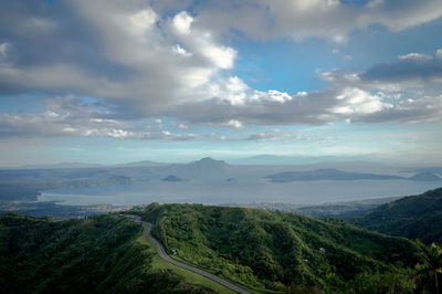 Scenic view of landscape against cloudy sky