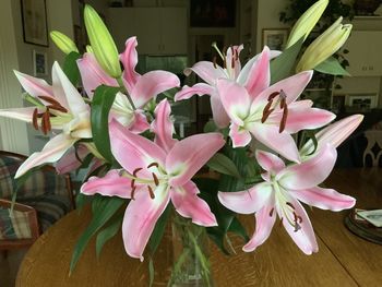 Close-up of pink flowers on table at home