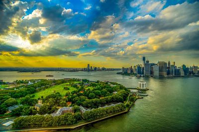 City at waterfront during sunset