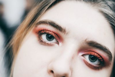 Close-up portrait of woman with eye make-up