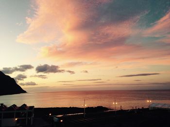 Scenic view of sea against cloudy sky