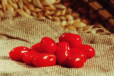 Close-up of red berries on wooden table