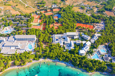 High angle view of swimming pool by buildings in town