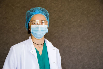 Woman doctors portrait, doctors with mask, glasses, glove and uniform. 