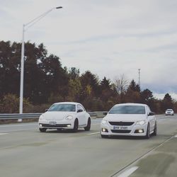 Cars on road against sky