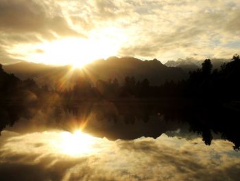 Scenic view of lake at sunset