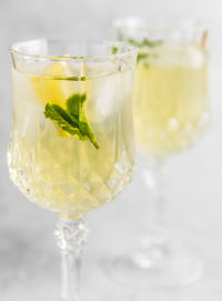 Close-up of lemon and mint drink on table