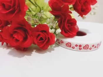 High angle view of red roses on table