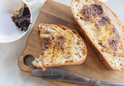 High angle view of bread on cutting board