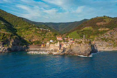 Scenic view of sea and buildings against sky