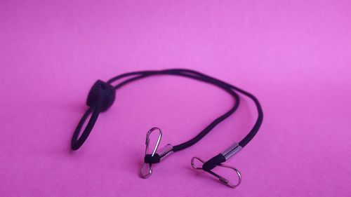 High angle view of eyeglasses on purple table