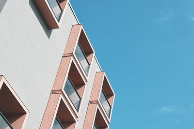 Low angle view of modern building against clear sky