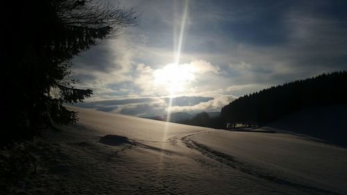 Scenic view of landscape against sky during winter