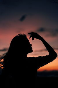 Portrait of silhouette woman against sky during sunset