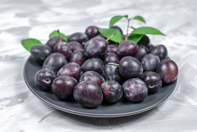 Close-up of grapes on table