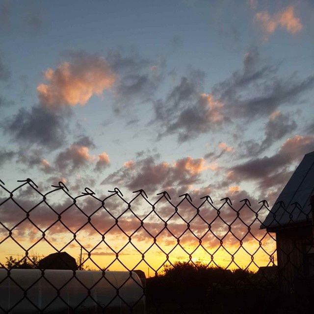 sunset, sky, fence, cloud - sky, protection, safety, chainlink fence, cloudy, security, cloud, orange color, silhouette, landscape, barbed wire, field, nature, beauty in nature, dramatic sky, scenics, metal