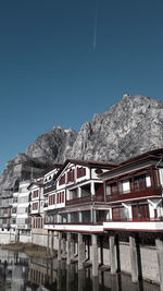 Low angle view of buildings against clear blue sky