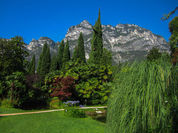 Scenic view of mountains against clear blue sky