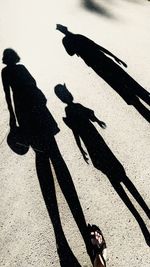 Shadow of people on street