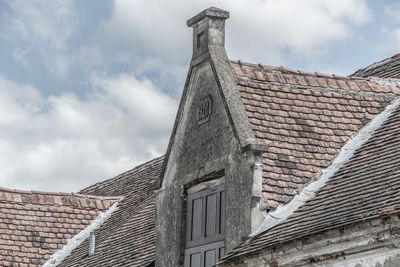 Low angle view of roof against sky