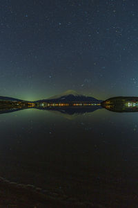 Mt. fuji and the starry sky in lake yamanaka